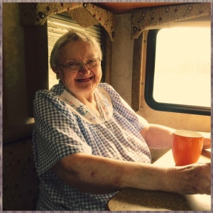 Mom drinking her coffee in the RV